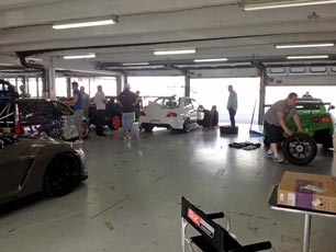 Inside our busy Pit Garage before the Free Practice Session Inside our busy Pit Garage before the Free Practice Session